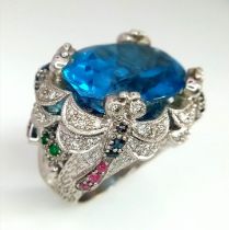 An 18kt White Gold Exquisite Fancy Cocktail Ring Set with Diamonds, Rubies, Sapphires & Emeralds