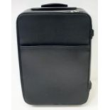 A Louis Vuitton Black Pegase Suitcase. Taiga leather exterior. Features an exterior zip pocket,