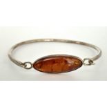 A Vintage 925 Silver and Amber Clip Bangle.