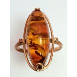 A vintage, 9 K rose gold ring with a large amber cabochon. Size: N1/2, weight: 3 g. 14209