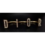 An iconic and rare, three finger CHRISTIAN DIOR spell-out ring designed by John Galliano, one of the