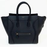 Celine Black Luggage Handbag. Quality leather interior/exterior. Design offers ample space for all