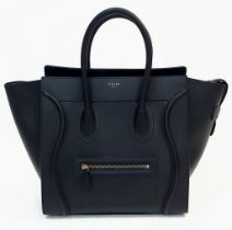 Celine Black Luggage Handbag. Quality leather interior/exterior. Design offers ample space for all