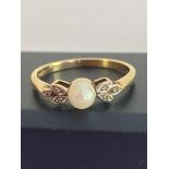 Stunning 9 carat YELLOW GOLD RING set with PEARL to centre having attractive DIAMOND shoulders in