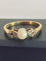 Stunning 9 carat YELLOW GOLD RING set with PEARL to centre having attractive DIAMOND shoulders in