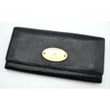 A Mulberry Black Purse/Wallet. Leather exterior with the iconic Mulberry logo on a gold-toned plaque