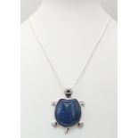 A Lapis Lazuli Turtle Pendant on a 925 Silver Necklace. 4cm and 42cm.