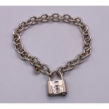 A 925 Sterling Silver Tiffany and Co Marked Link Bracelet with Padlock Charm. 16cm.
