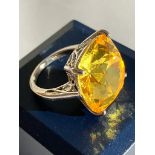 SILVER RING set to top with an enormous LEMON QUARTZ SOLITAIRE in an Attractive, filigree cradle