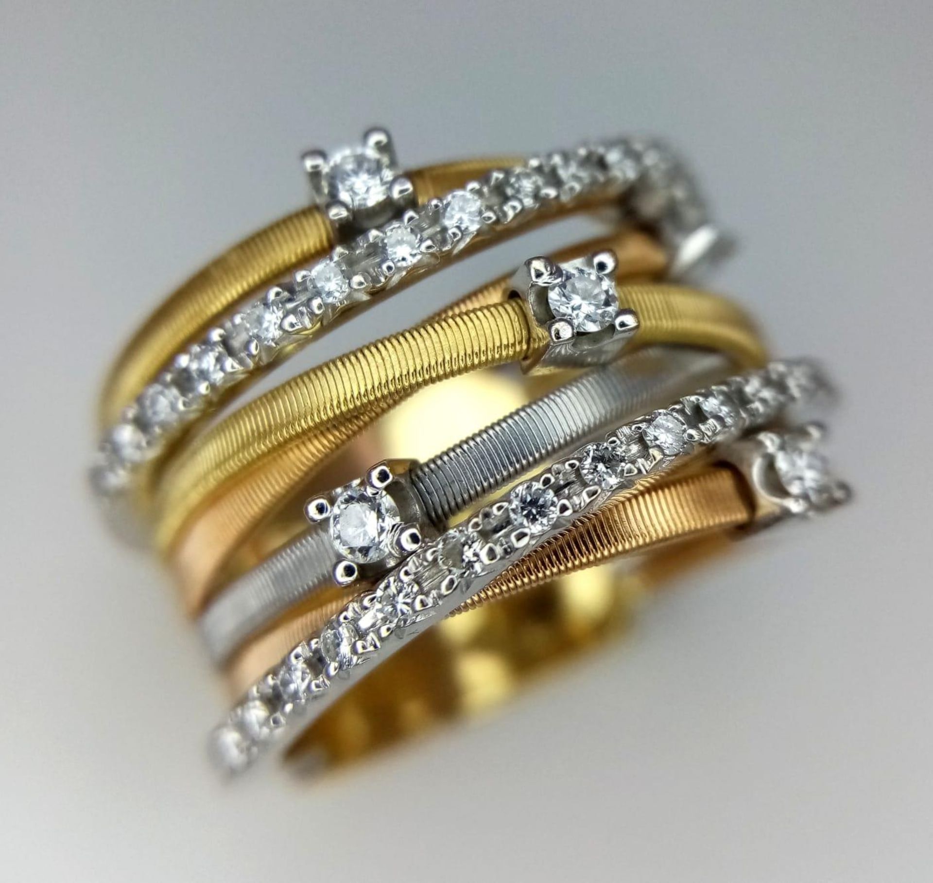 An Italian 18K Yellow and White Gold Diamond Orbital Ring. Front band of gold interspersed with - Bild 2 aus 10