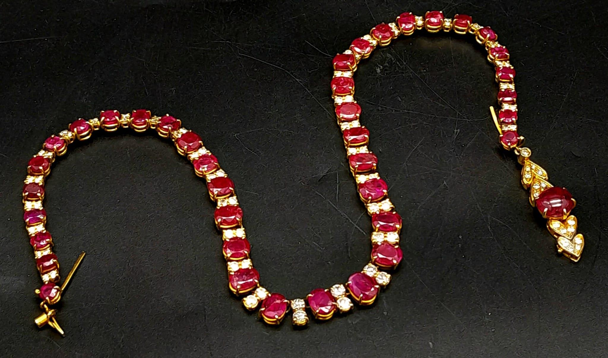 A vintage, 9 K yellow gold necklace loaded with oval cut natural rubies and round cut diamonds. - Image 3 of 10