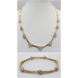 A Gorgeous 18K Gold and Heart-Diamond Necklace and Bracelet Set. The necklace is decorated with