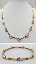 A Gorgeous 18K Gold and Heart-Diamond Necklace and Bracelet Set. The necklace is decorated with