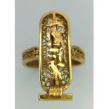 An 18 K yellow gold filigree ring with a three dimensional cartouche of Cleopatra, the most