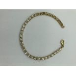 Fabulous SILVER TENNIS BRACELET Having 34 Oval Cut TOPAZ GEMSTONES Set individually in Articulated