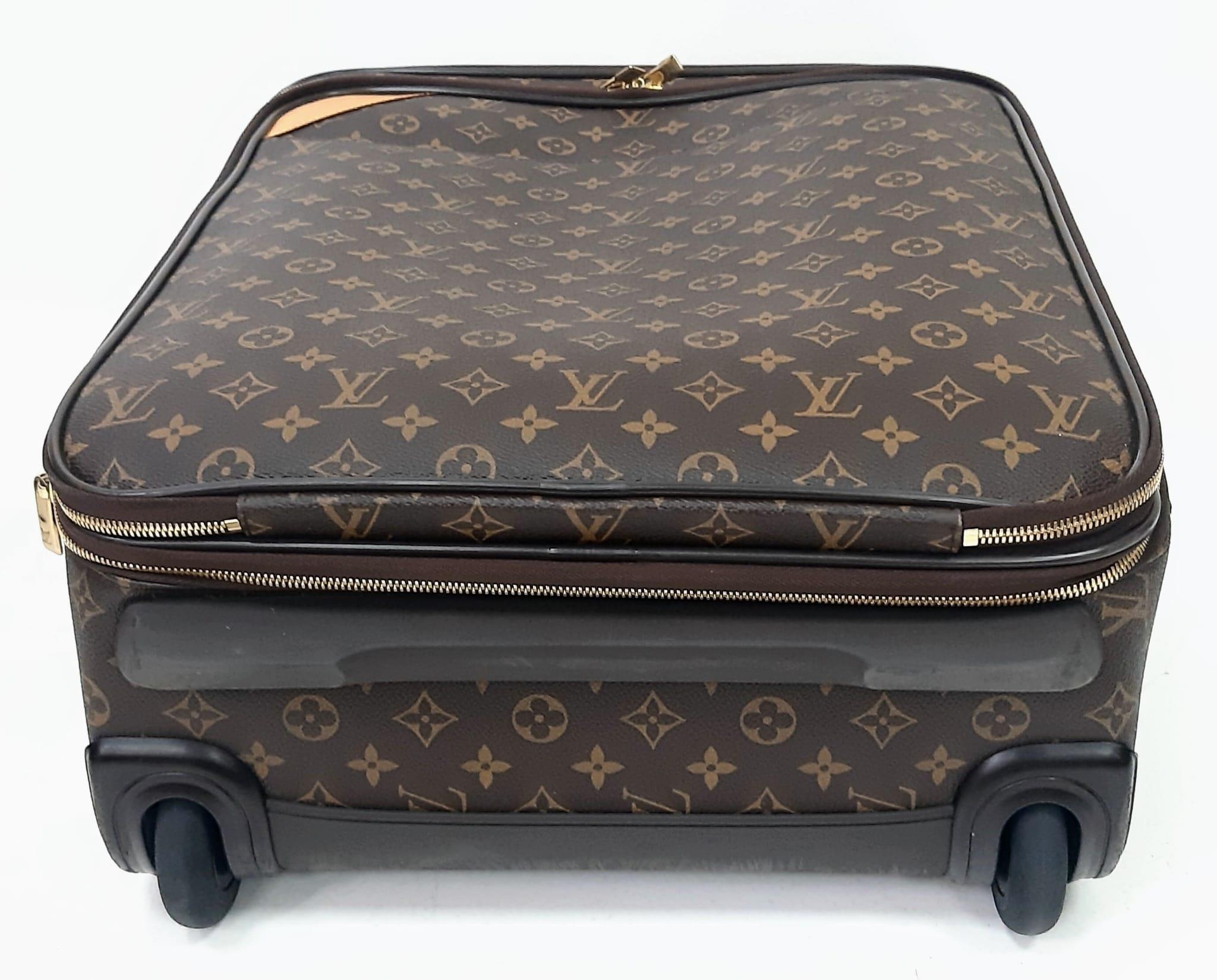A Louis Vuitton Monogram Pegase Suitcase. Durable leather exterior. Front compartment with zipper, - Image 5 of 9