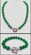A glamorous, high quality, green jade necklace and bracelet set with spectacular modern clasps