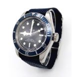 A Tudor Geneve Chronometer Gents Watch. Blue textile strap. Stainless steel case - 41mm. Black dial.