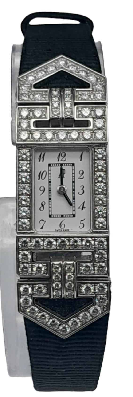 An 18K White Gold and Diamond Audemars Piguet Ladies Watch. Black leather strap with an 18k gold