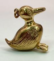 A 9K YELLOW GOLD DUCK CHARM. 2.5cm length, 2.2g total weight.