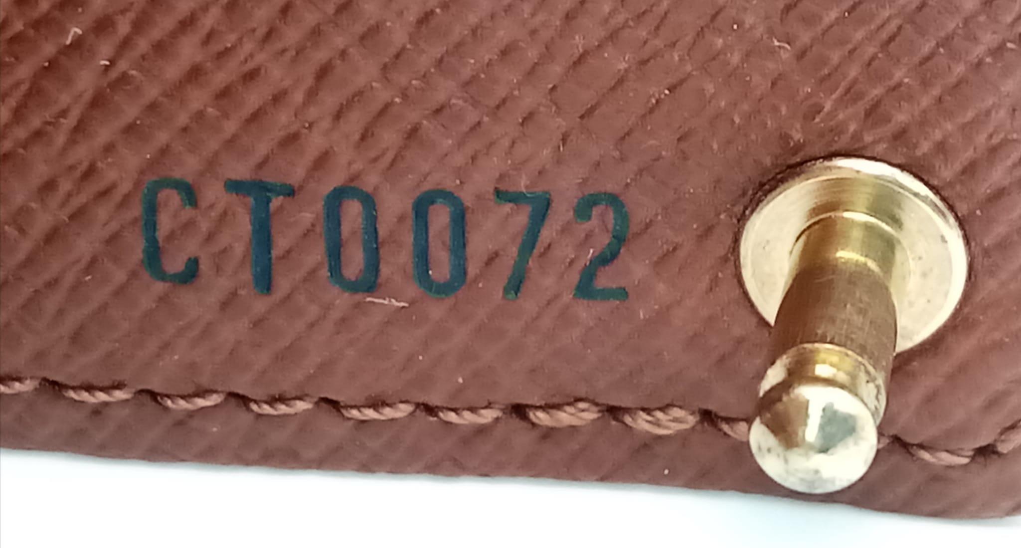 A Louis Vuitton Monogram Card Holder. Pebbled leather exterior, press stud closure. Brown leather - Image 5 of 7