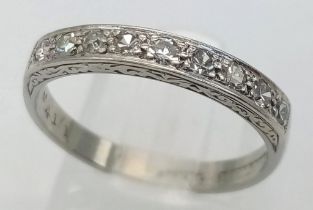 AN 18K WHITE GOLD & PLATINUM DIAMOND SET HALF ETERNITY RING. Size N, 0.25ctw, 2.9g total weight.