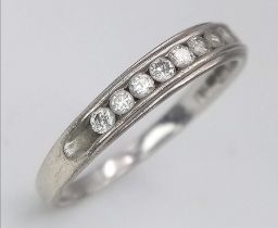 A 9K White Gold Diamond Half Eternity Ring. Size N. 1.7g total weight. Ref: 14491