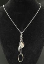 A Sterling silver multi-charm necklace. Total weight 9g. Total length 18 inches.