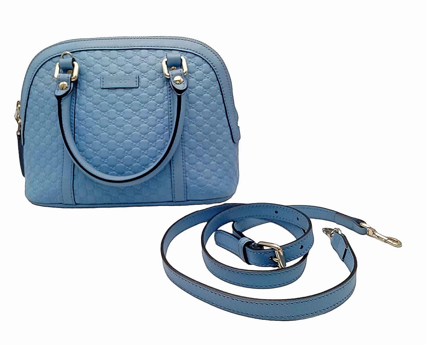 A Gucci Cornflower Blue Micro Guccisima Dome Bag. Monogram leather exterior with rolled leather