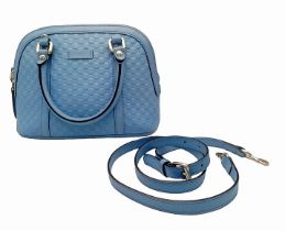 A Gucci Cornflower Blue Micro Guccisima Dome Bag. Monogram leather exterior with rolled leather