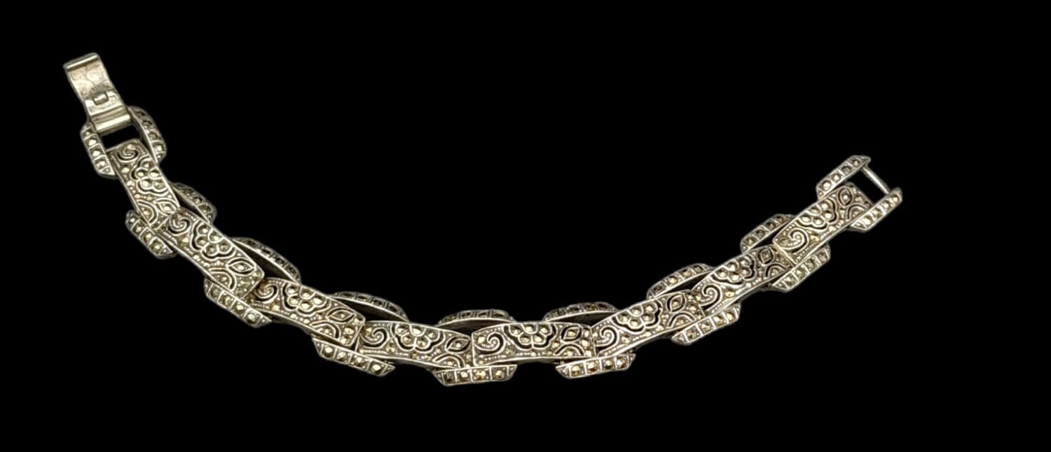 A vintage, sterling silver bracelet, with an elaborate filigree design studded with marcasite. - Image 2 of 5