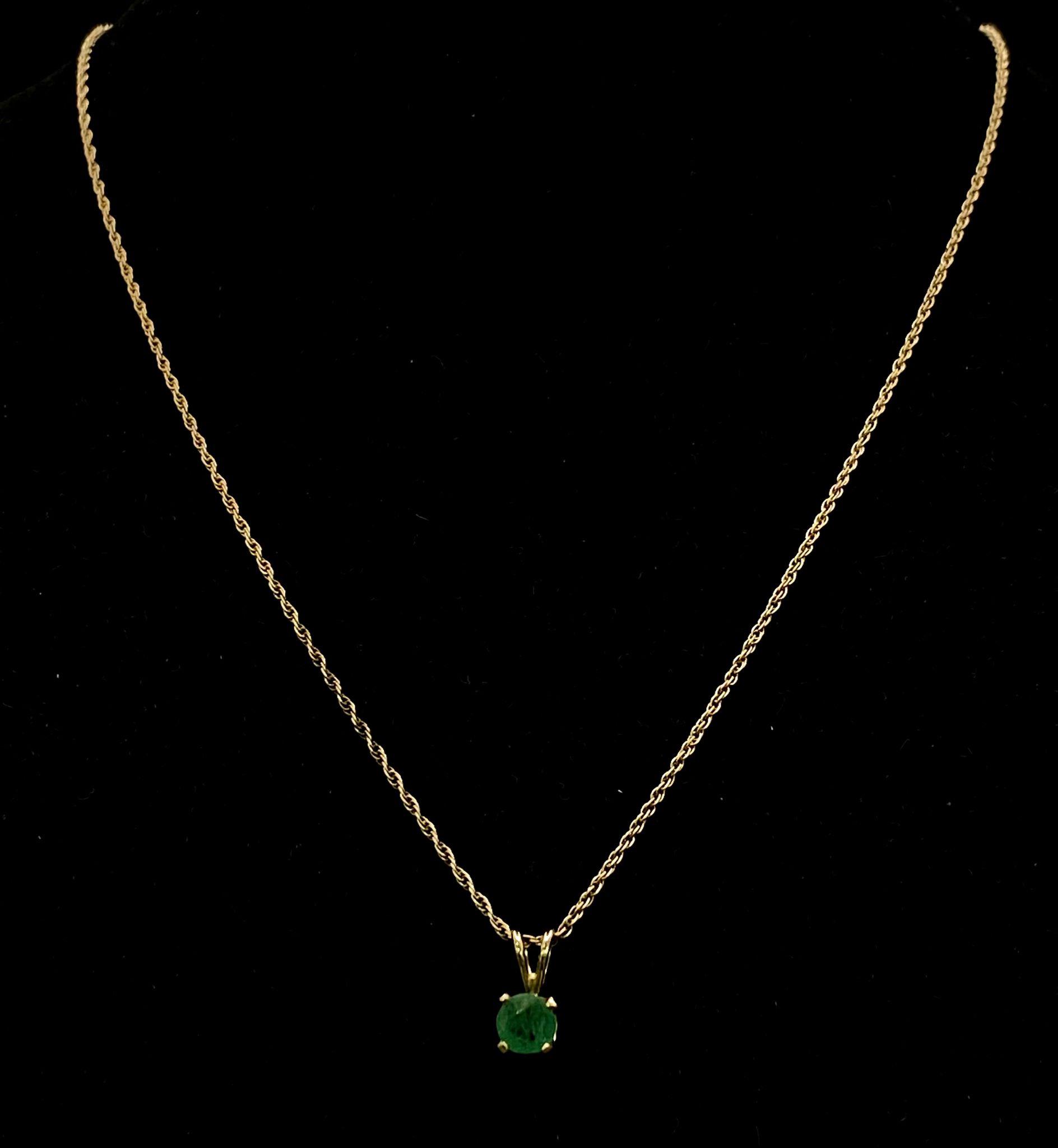 A 14k Yellow Gold Emerald Pendant on a 14k Yellow Gold Necklace. 12mm and 46cm. 2.53g total weight.