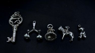 Collection of white metal Charms/Pendants. Featuring a 21 Key, Scales, Horse & Rider, Bell and a