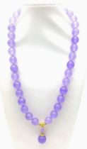 A Lavender Jade Large Bead Necklace with Pendant Drop. 12mm jade beads with gilded accents and