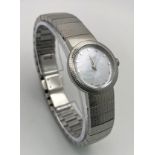 A Designer Christian Dior Quartz Ladies Watch. Stainless steel bracelet and case - 23mm. White dial.