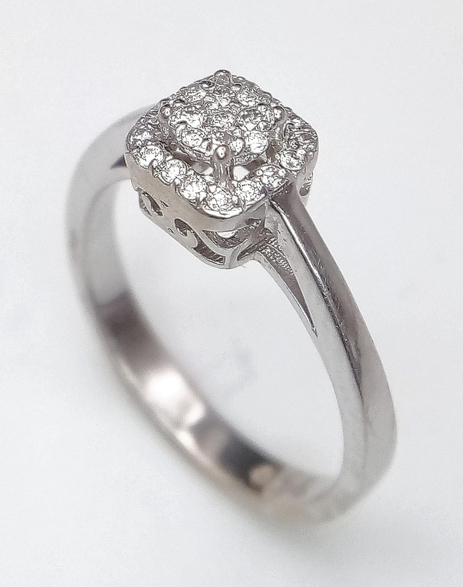 An 18K White Gold and Diamond Encrusted Ring. An encrusted circle within a square. Size J. 2.73g - Image 2 of 4