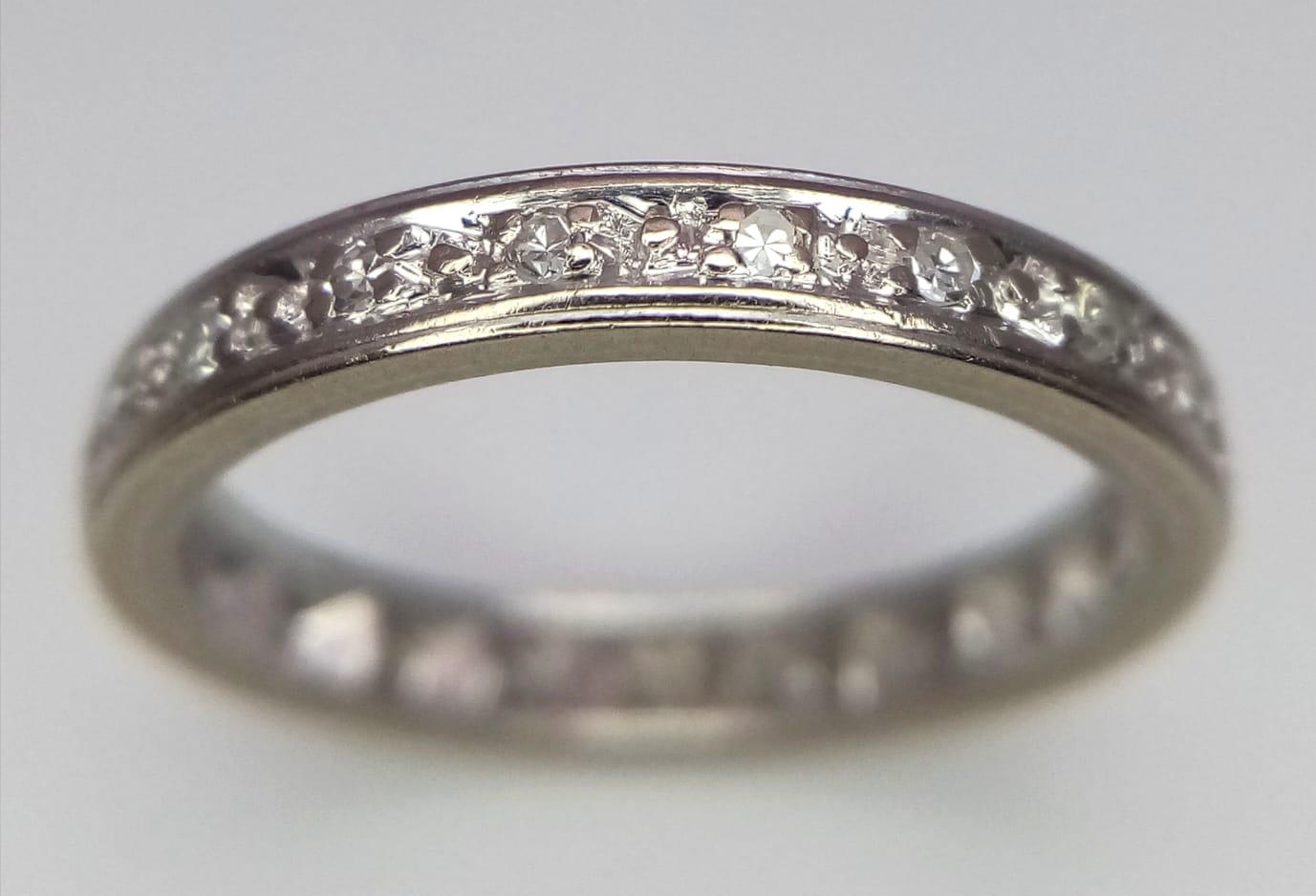 A VINTAGE 18K WHITE GOLD DIAMOND FULL ETERNITY RING. Size L/M, 2.9g total weight. - Image 2 of 3