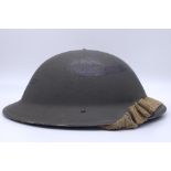 1943 Dated British MK II Helmet. Original Paint. Makers Marked RO & CO. With original chin strap.