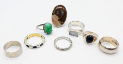 A Selection of Eight Different Styled 925 Silver Rings, Different Sizes. Please see photos for finer