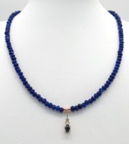 A Sapphire Small Bead Necklace with Diamond and Sapphire Hanging Decoration. 0.07ct diamond. 14k