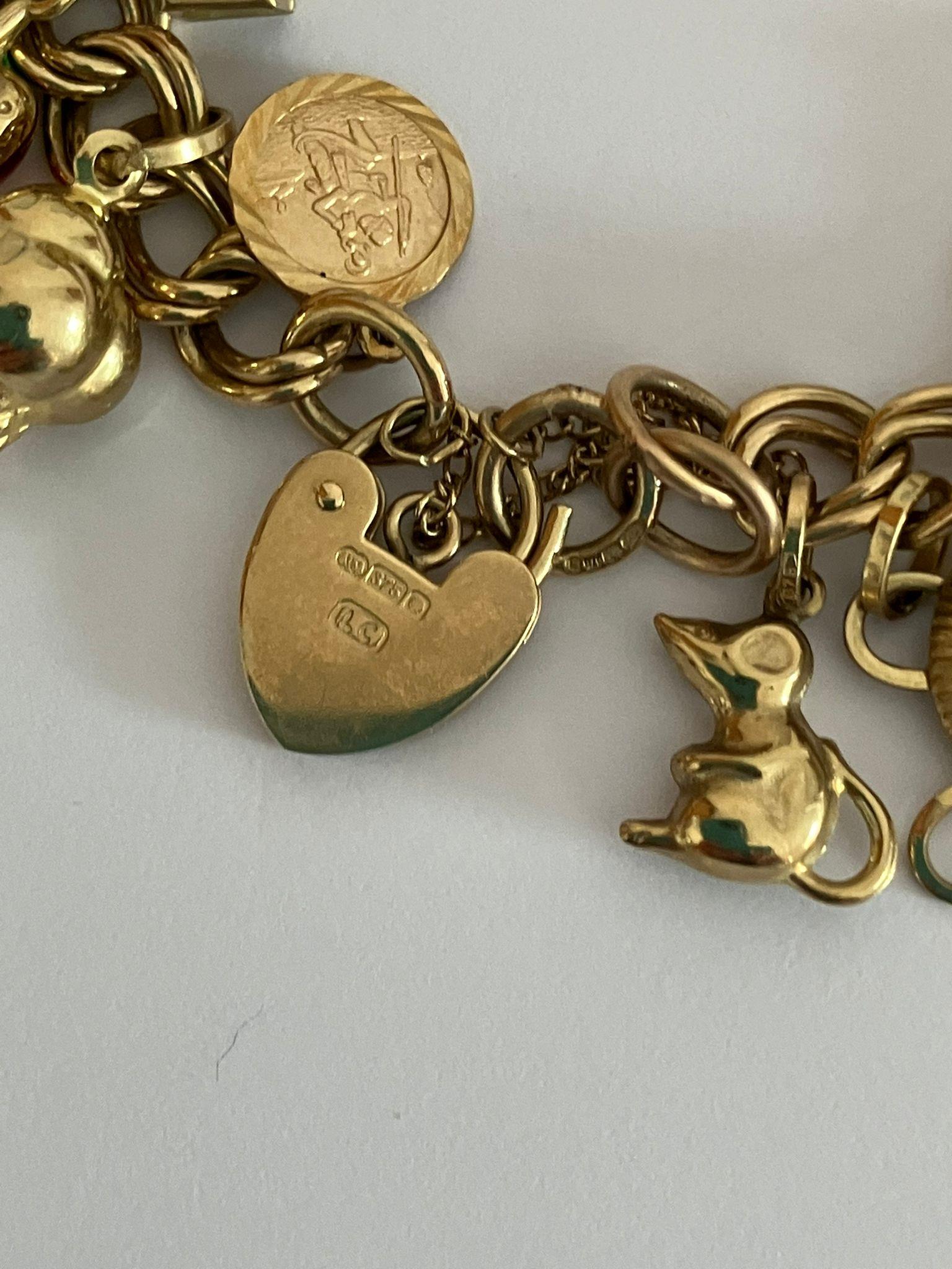 9 carat GOLD CHARM BRACELET Absolutely full of Gold charms, To include Dolphin, Ladybird, Magic - Image 3 of 6