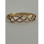 9 carat GOLD RING Having attractive Celtic openwork design to top. Complete with ring box. 0.8