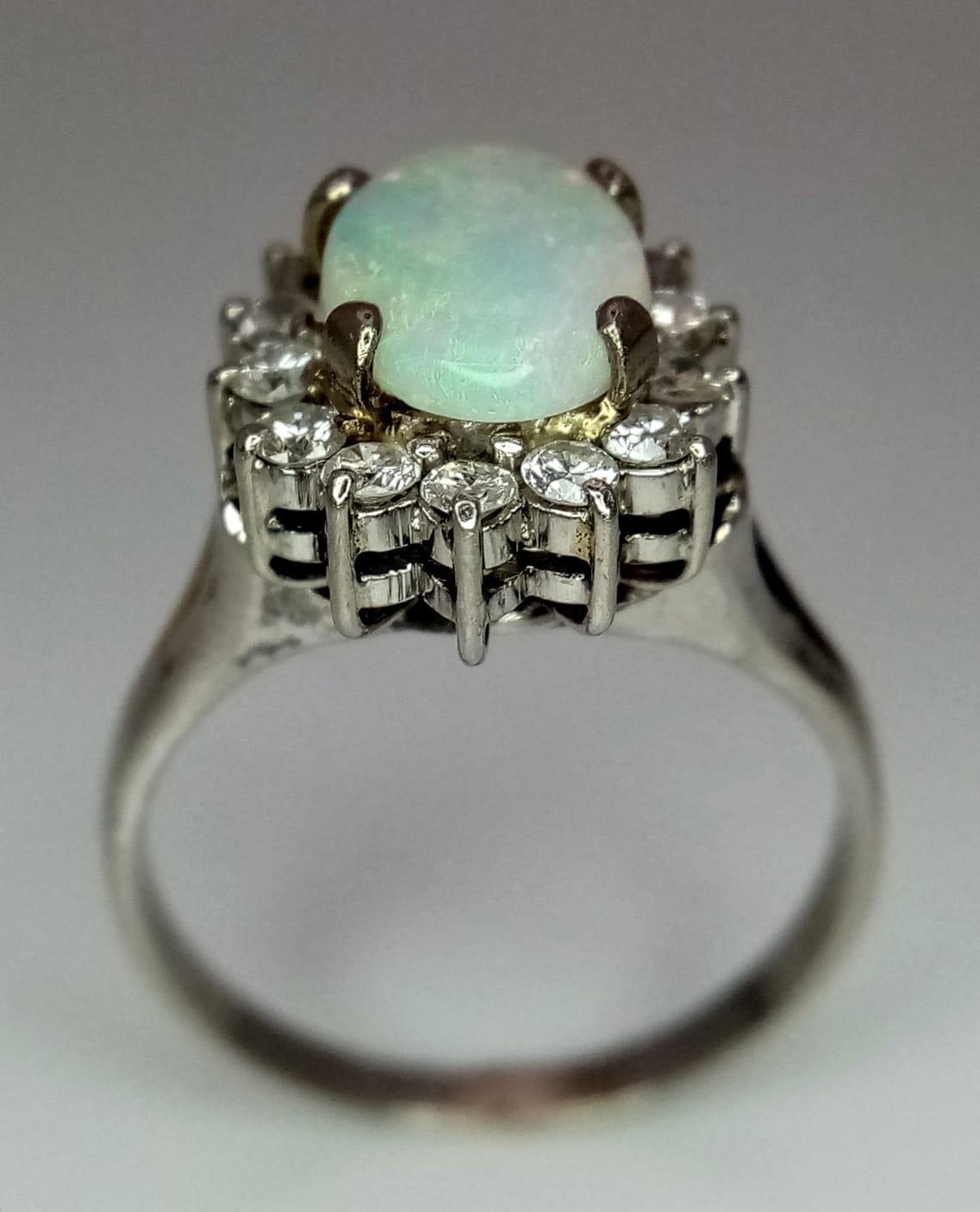 An 18K White Gold (tested) Opal and Diamond Ring. Central oval opal cabochon - 1ct approx, - Image 6 of 9