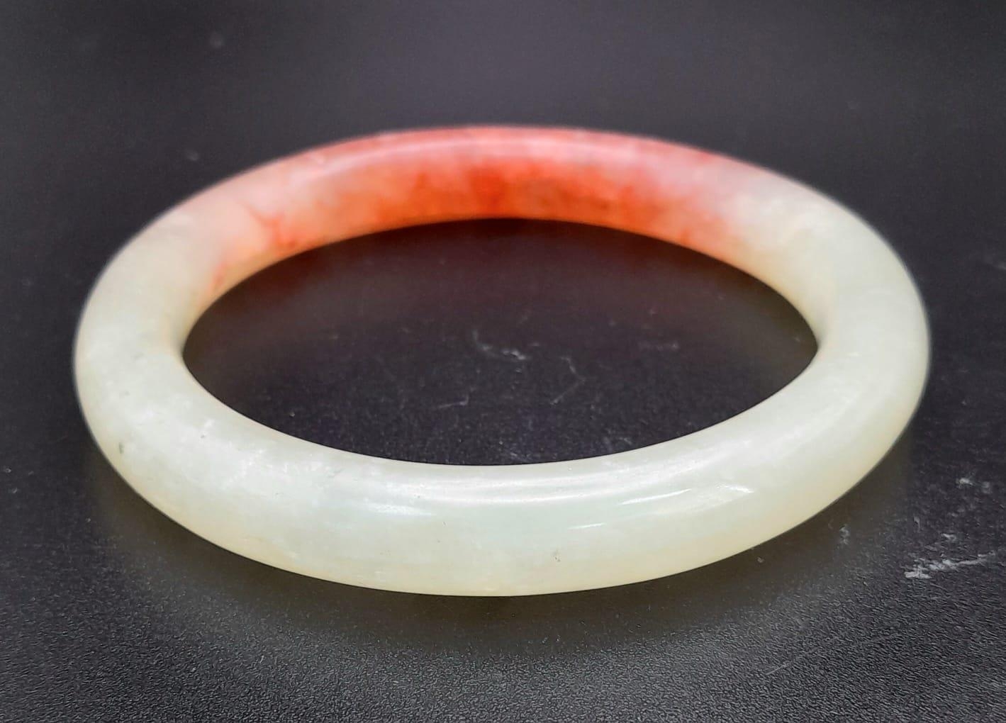 Boxed Jade bangle. Beautiful powdered green with red highlights. 8cms in diameter. - Image 3 of 4