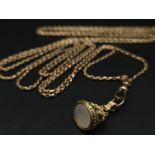 An Antique 9K Yellow Gold Long Pocket Watch Chain with a Hanging 9K Yellow Gold Fob with