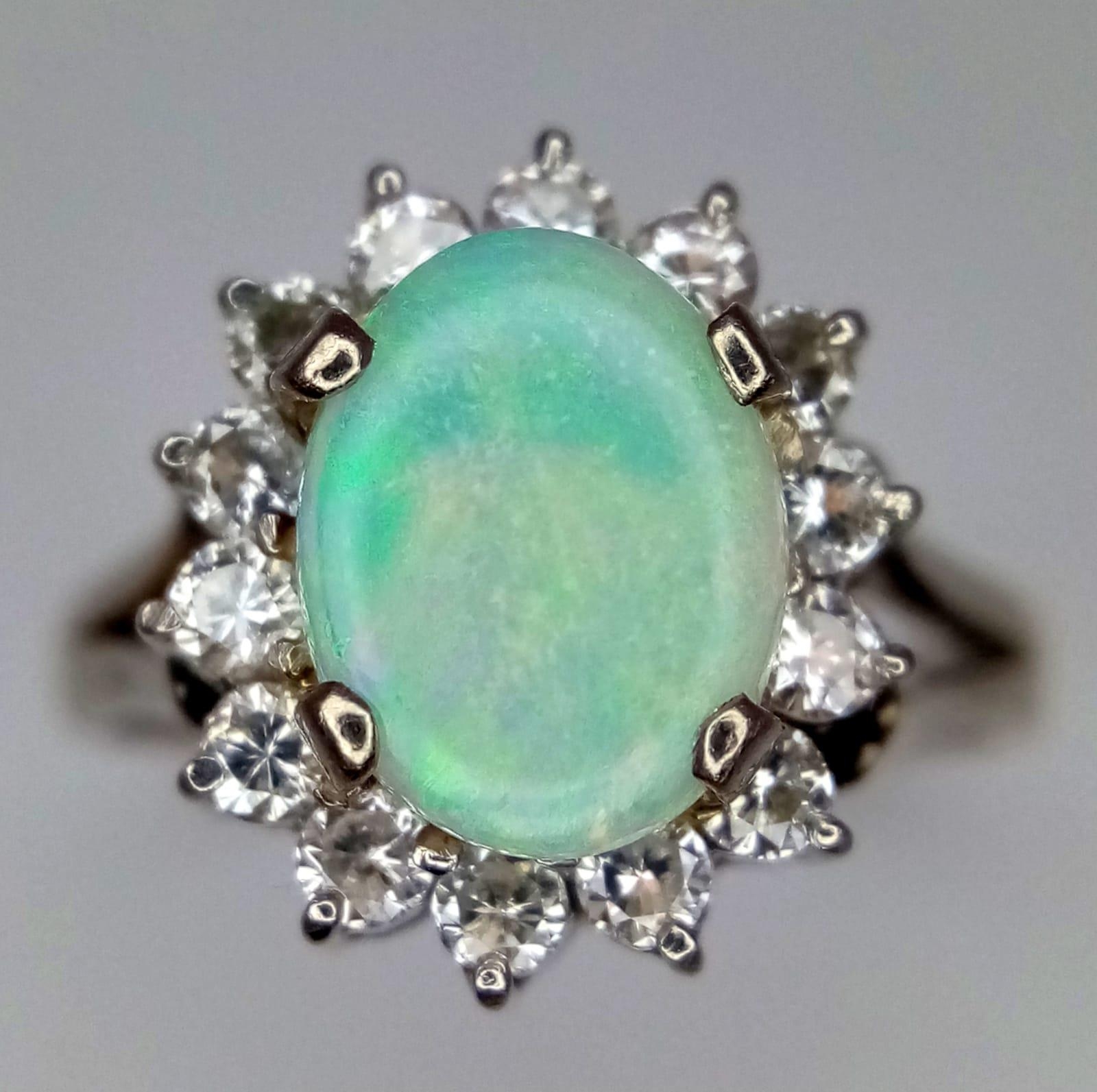 An 18K White Gold (tested) Opal and Diamond Ring. Central oval opal cabochon - 1ct approx, - Image 4 of 9