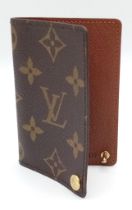 A Louis Vuitton Monogram Card Holder. Pebbled leather exterior, press stud closure. Brown leather