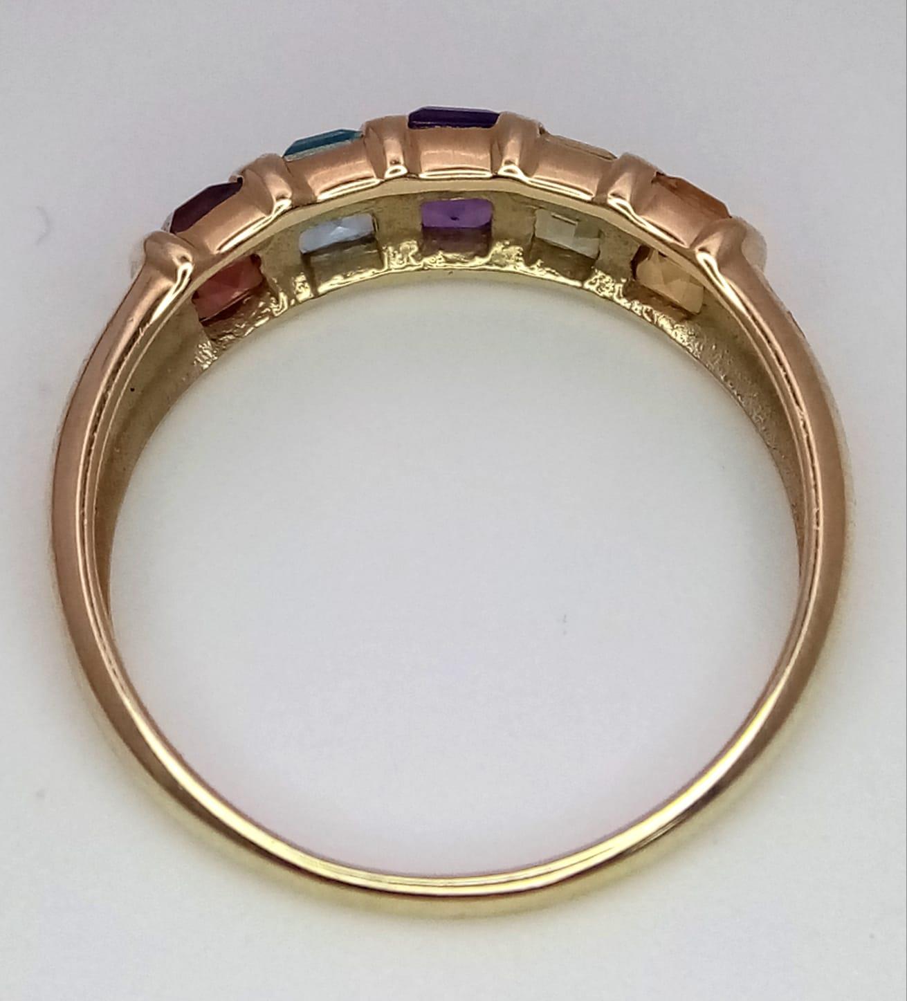 A 9K YELLOW GOLD GEM SET RING. Includes peridot, garnet, topaz, amethyst and citrine. Size P, 2.4g - Image 3 of 4