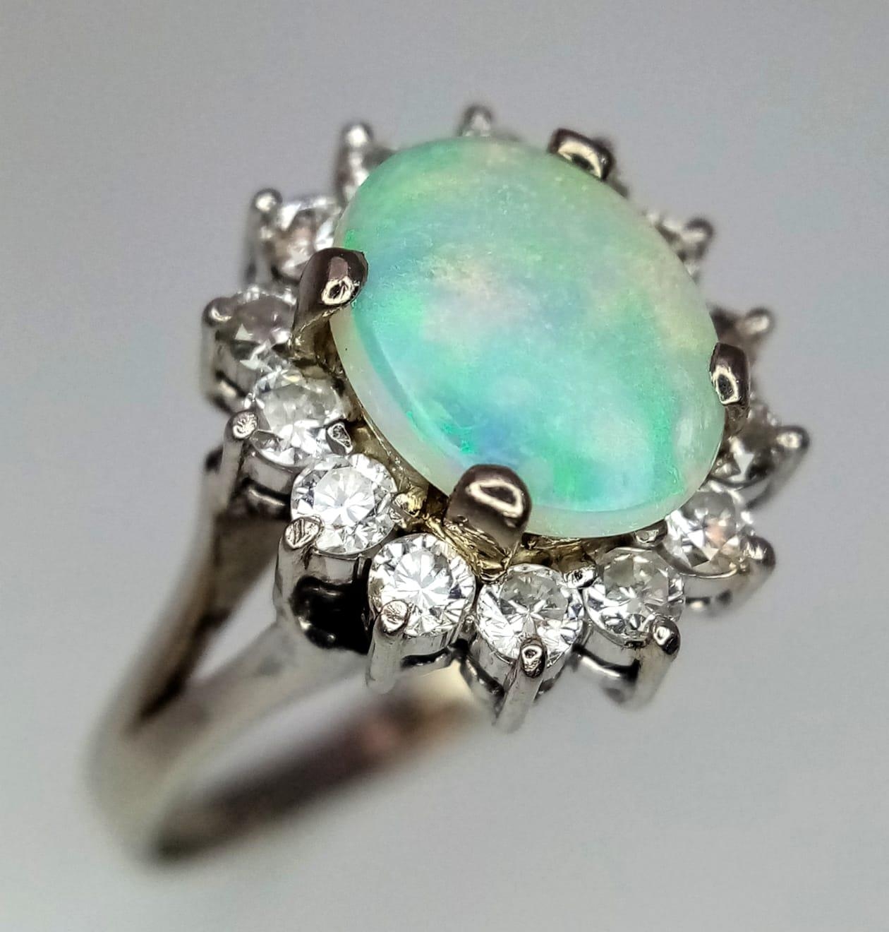 An 18K White Gold (tested) Opal and Diamond Ring. Central oval opal cabochon - 1ct approx, - Image 3 of 9