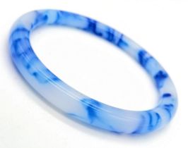 A Thin Blue and White Chinese Swirl Jade Bangle. 6cm inner diameter. 8mm width